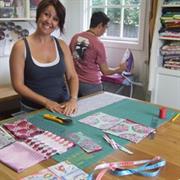 Casey cutting out squares for her quilt