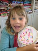 showing her running stitch for her canvas made at the school holiday workshop at Frolic in Fabric