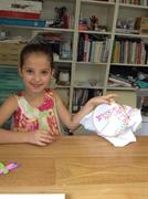 showing her running stitch made at the school holiday workshop at Frolic in Fabric